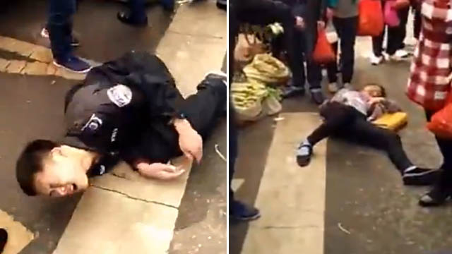 城管与女子起冲突双双玩假摔