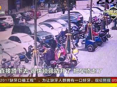 男子骑车溜入停车场 专盗高档山地自行车