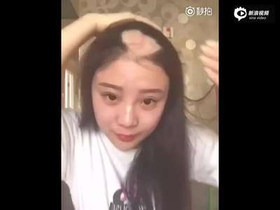 [视频]美女模仿电钻啃玉米失手 头发被大片扯掉就医